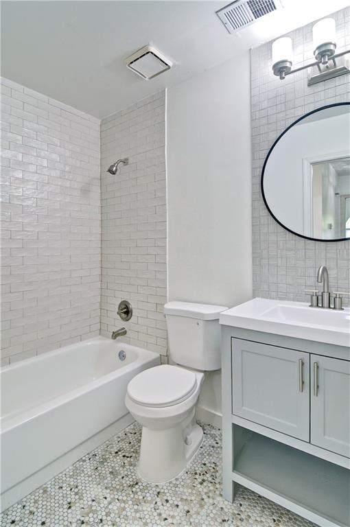2665 Ivydale Court Southwest Atlanta, GA 30311 - Photo 25 of 45 a bathroom with a sink toilet and shower