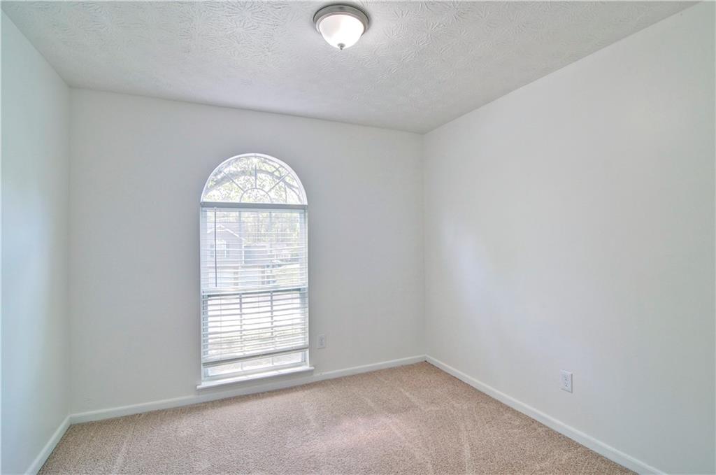 2665 Ivydale Court Southwest Atlanta, GA 30311 - Photo 28 of 45 an empty room with a window