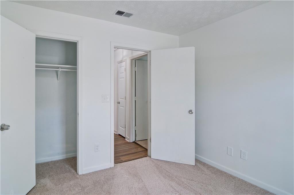 2665 Ivydale Court Southwest Atlanta, GA 30311 - Photo 29 of 45 a view of a livingroom with wooden floor