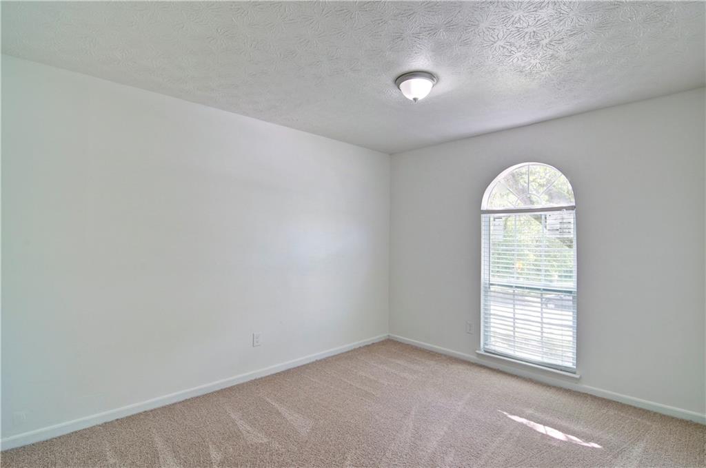 2665 Ivydale Court Southwest Atlanta, GA 30311 - Photo 30 of 45 an empty room with a window