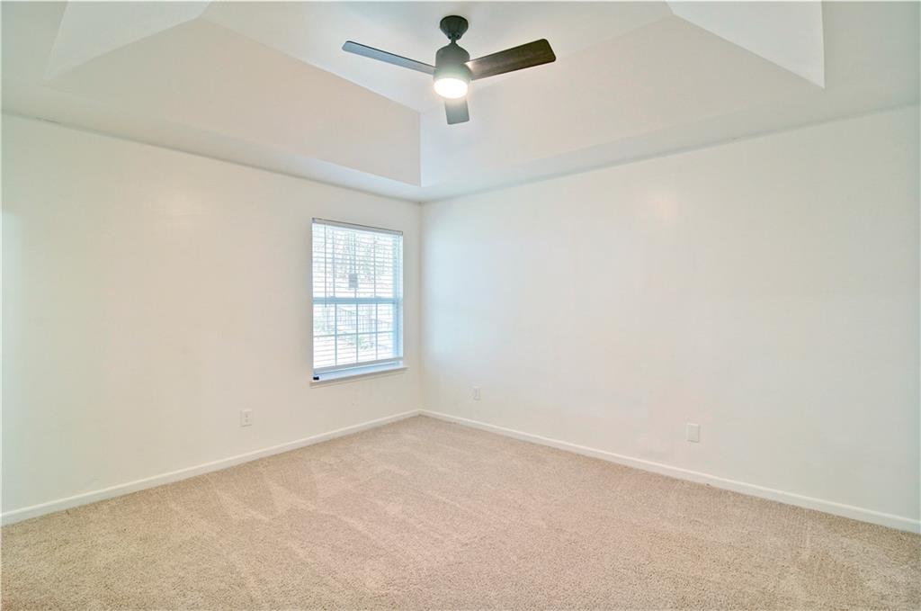 2665 Ivydale Court Southwest Atlanta, GA 30311 - Photo 32 of 45 an empty room with a window and a fan