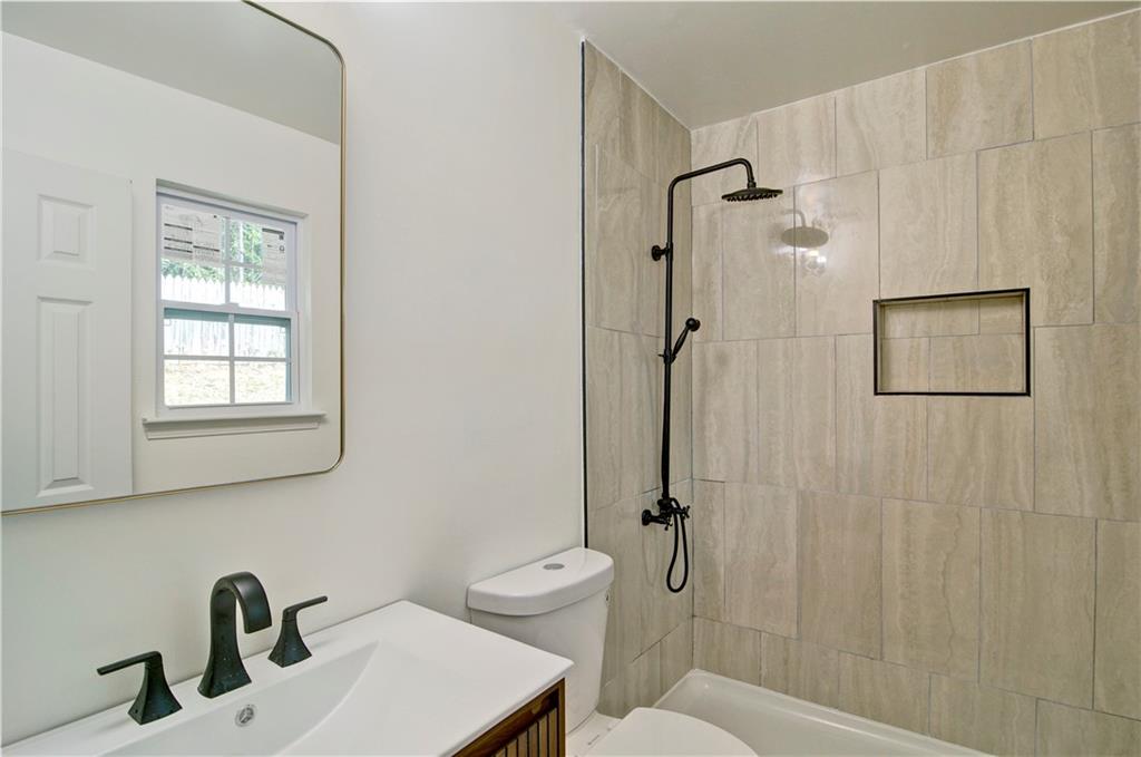 2665 Ivydale Court Southwest Atlanta, GA 30311 - Photo 37 of 45 a bathroom with a sink toilet and shower