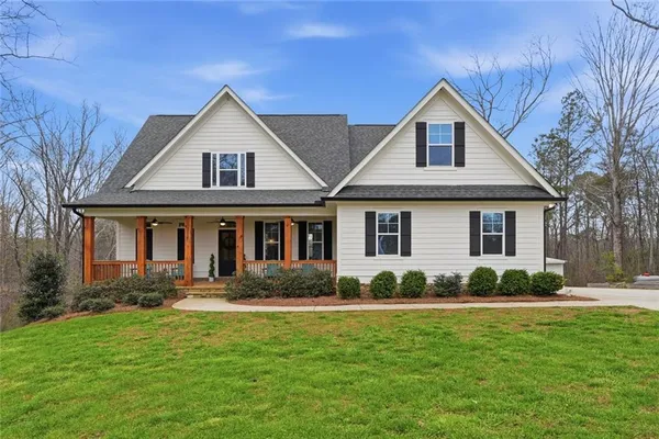 a front view of a house with a yard