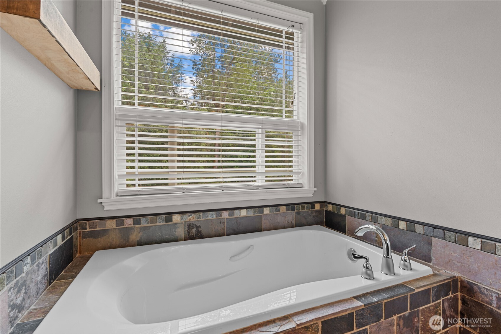 13402 Spiketon Road Buckley, WA 98321 - Photo 17 of 35 a bathroom with a bathtub and a window