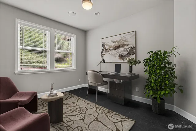 a living room with furniture and potted plant