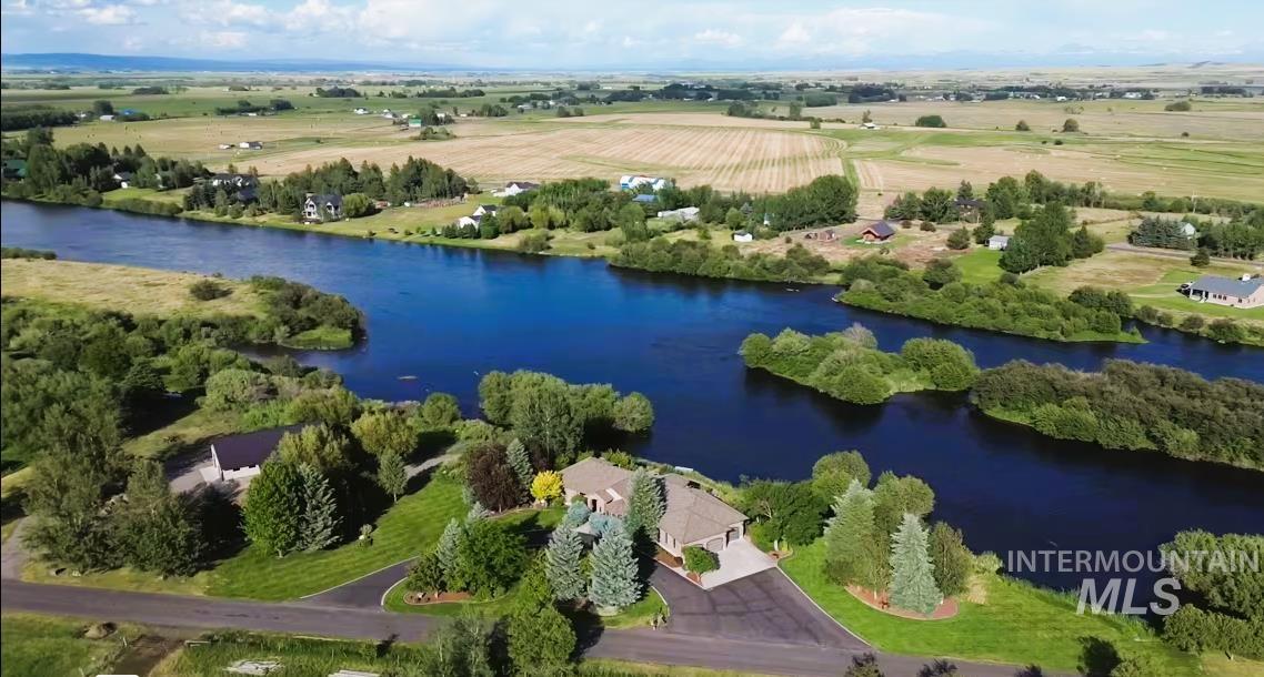 Enjoy the Henry's Fork of the Snake River right from your own backyard. PLUS...the main road that leads to this property dead ends into extensive Fish & Game land-Chesterfield Wetland Bird Refuge.