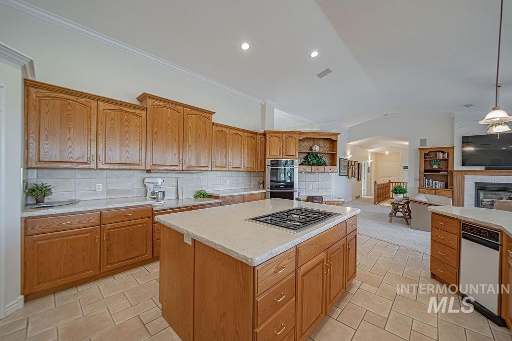 2700 North River Road St. Anthony, ID 83445 - Photo 16 of 50 This kitchen is a dream for bakers, canners, & chefs alike! With its expansive counter space, gas range, and double ovens, it offers everything needed to create culinary masterpieces.