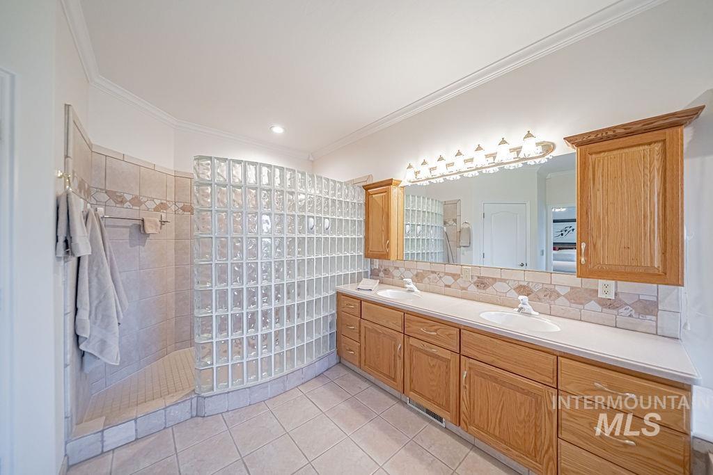 2700 North River Road St. Anthony, ID 83445 - Photo 23 of 50 Bathroom also boasts an extra-large walk-in shower, double vanity with plenty of storage, two walk-in closets - both equipped w/ built-in dressers & shelving.