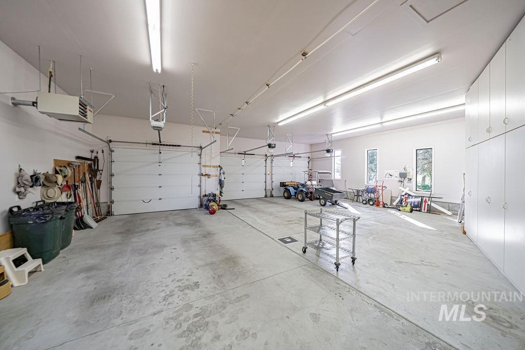 2700 North River Road St. Anthony, ID 83445 - Photo 32 of 50 Main House 3 Bay Extra deep and wide Garage. It is also Fully Insulated, Heated, has Utility Sink, and HOT/COLD water spigot.