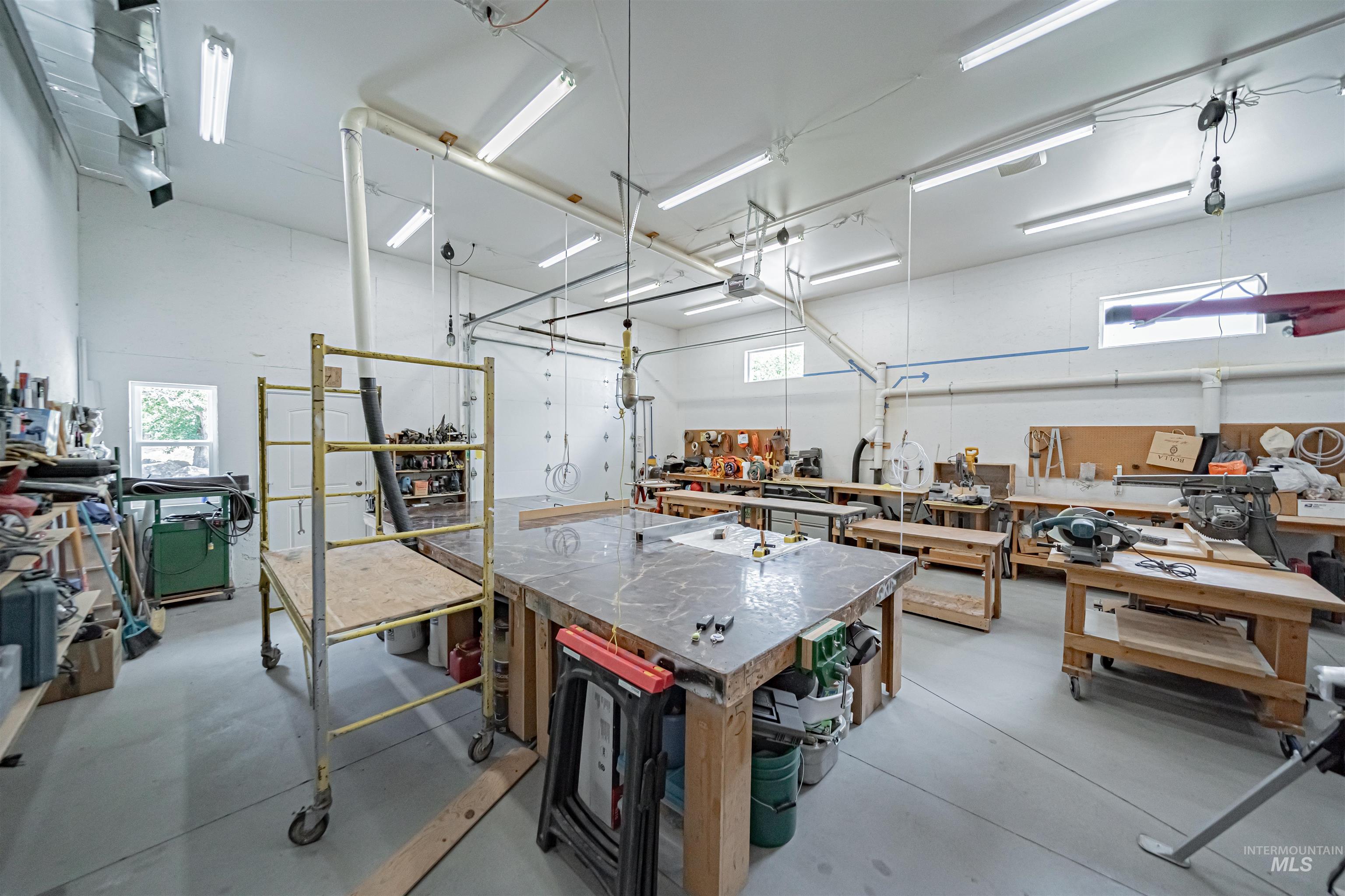 2700 North River Road St. Anthony, ID 83445 - Photo 43 of 50 36'X26' Woodworking Shop with heat and AC, utility sinks with hot and cold water, 1/2 bathroom. Compressor hook-ups and vacuum attachments near most major tools.