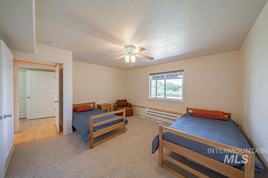 2700 North River Road St. Anthony, ID 83445 - Photo 46 of 50 Bedroom is spacious enough for a bed of any size. There is also a Walk in Closet, Ceiling fan, baseboard heaters.