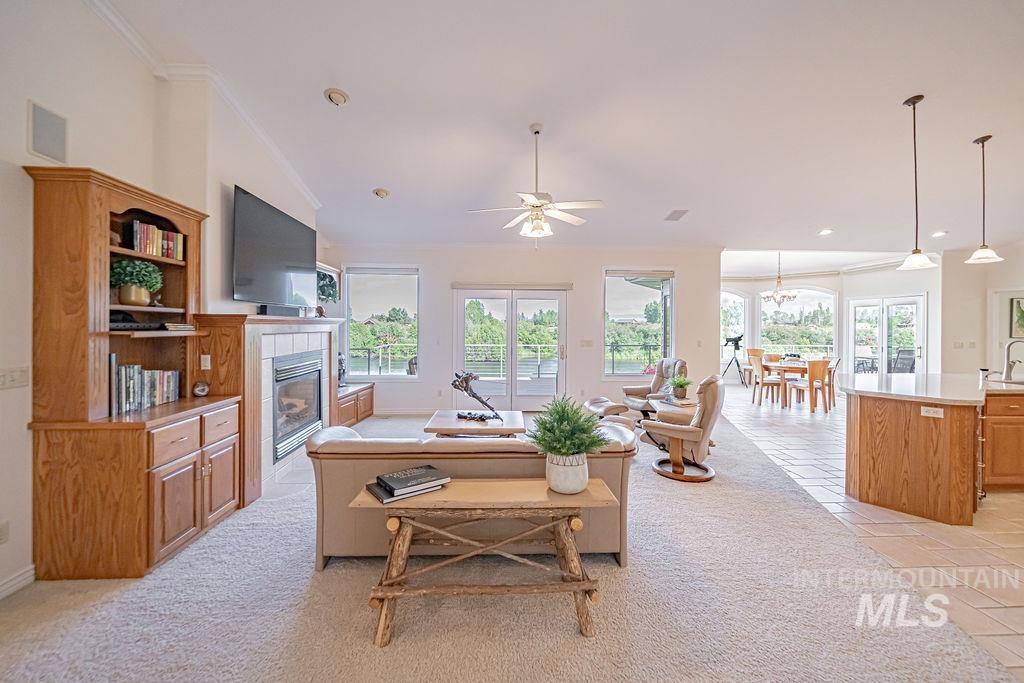 2700 North River Road St. Anthony, ID 83445 - Photo 10 of 50 This spacious room boasts vaulted ceilings, river views galore, surround sound, built-in bookcases and cabinets, gas fireplace and more. Plus the Open Concept Living is perfect for visiting with family or guests.