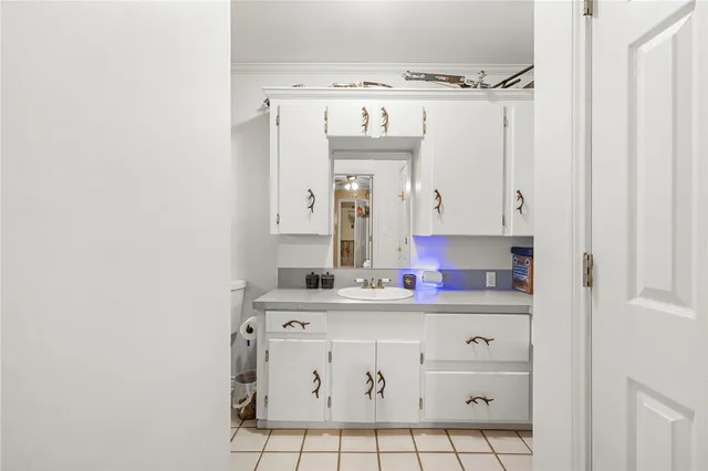 a bathroom with a sink a vanity and a mirror