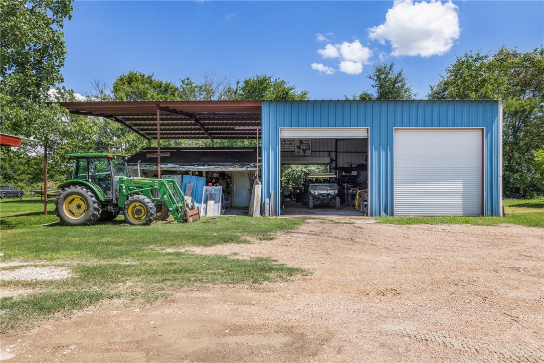 4450 Greenbriar Road Madisonville, TX 77864 - Photo 18 of 27 a front view of a house with garden