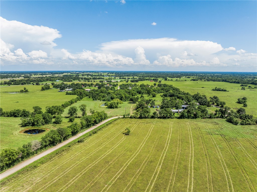 4450 Greenbriar Road Madisonville, TX 77864 - Photo 24 of 27 a view of a swimming pool and an outdoor seating