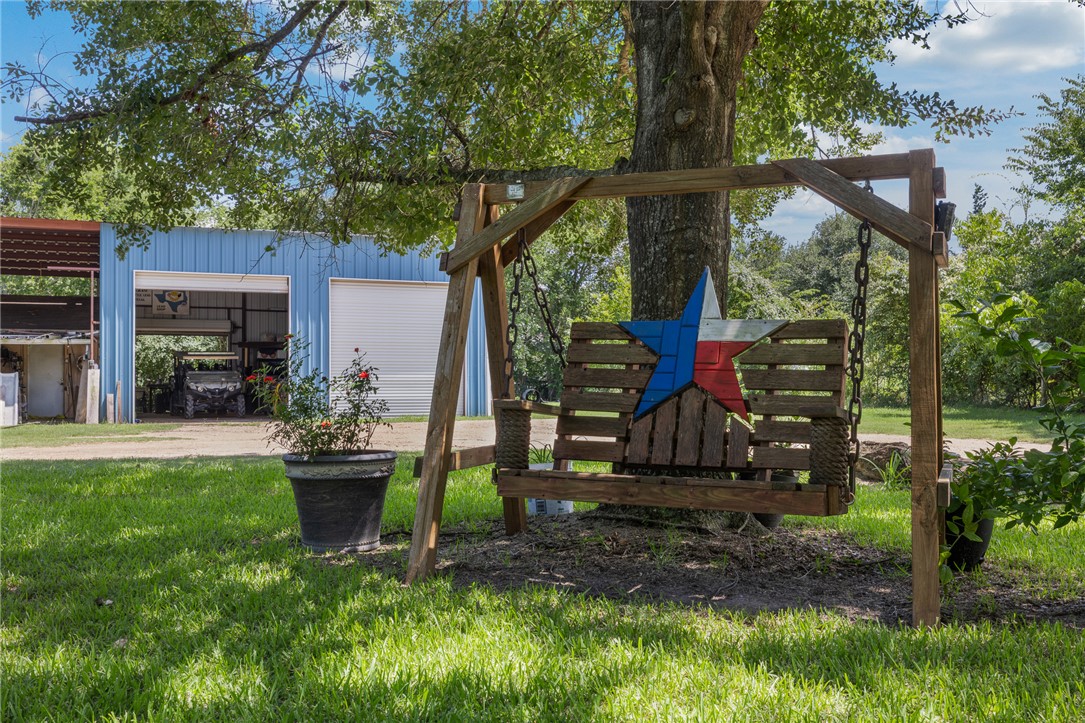 4450 Greenbriar Road Madisonville, TX 77864 - Photo 4 of 27 a garden view with a seating space