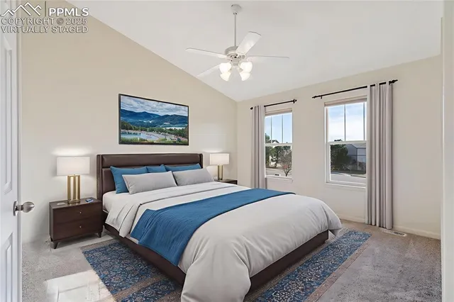 a bedroom with a large bed and a window