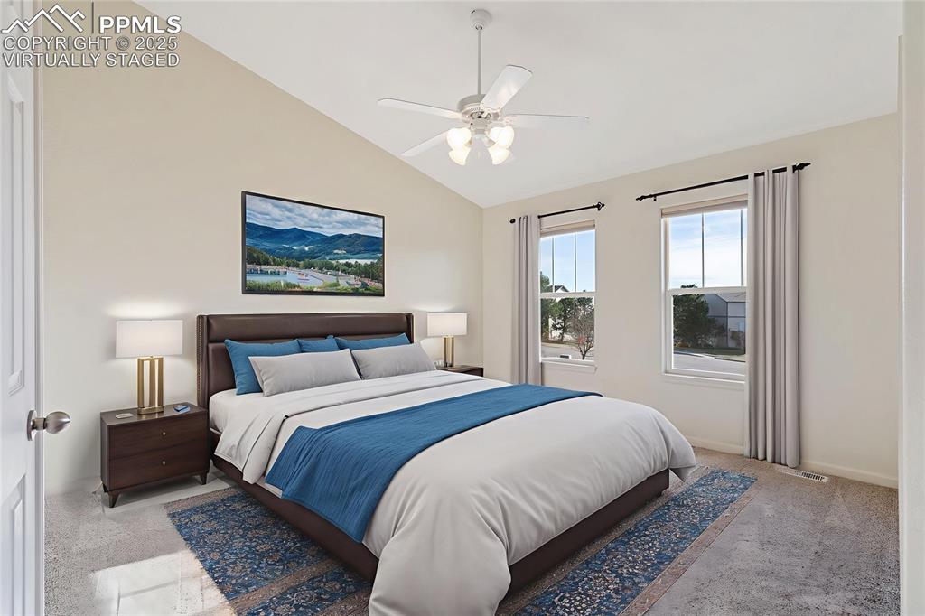 1243 Timber Run Heights Monument, CO 80132 - Photo 15 of 34 a bedroom with a large bed and a window