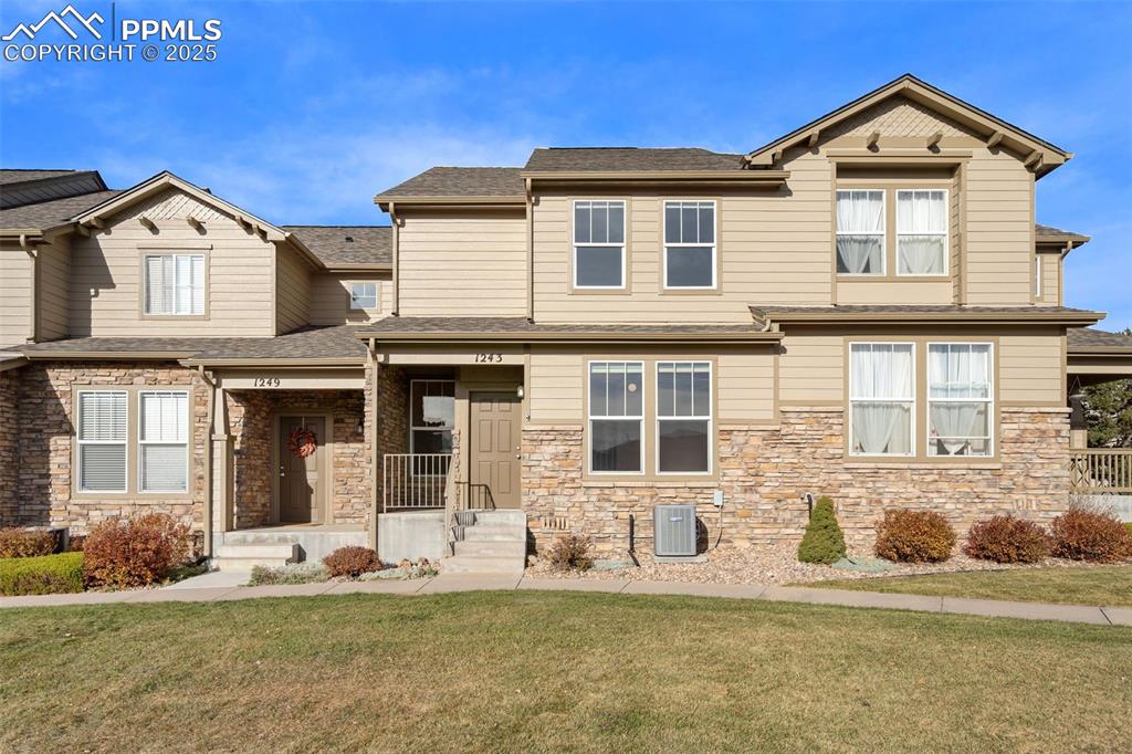 1243 Timber Run Heights Monument, CO 80132 - Photo 2 of 34 a front view of a house with a yard