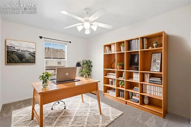 a workspace with furniture and window