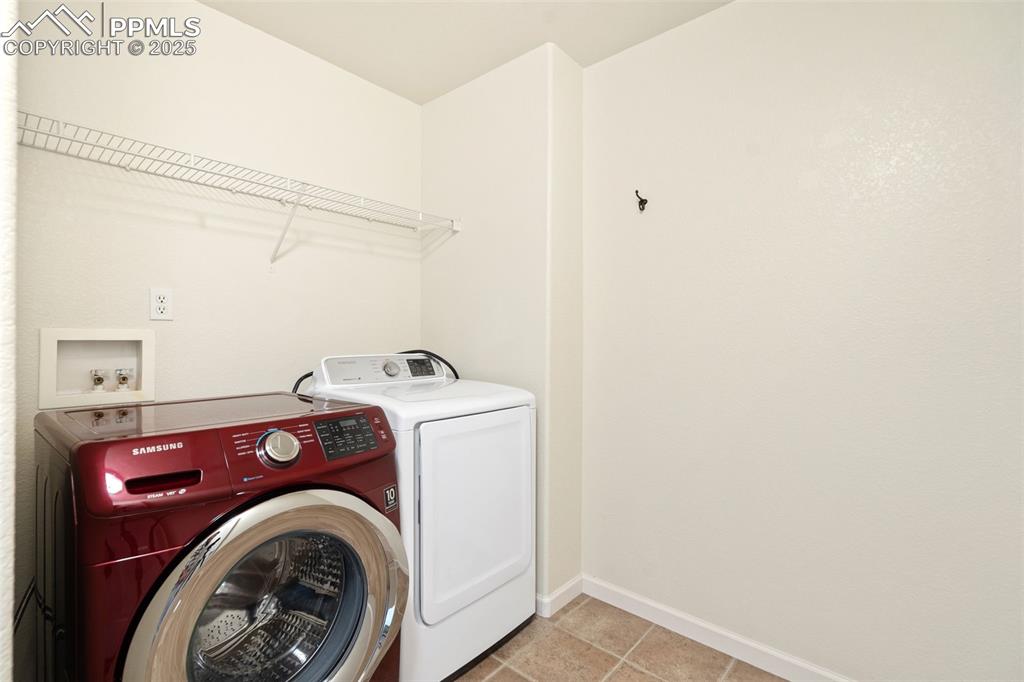 1243 Timber Run Heights Monument, CO 80132 - Photo 24 of 34 a utility room with dryer and washer