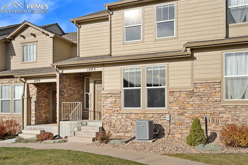 1243 Timber Run Heights Monument, CO 80132 - Photo 25 of 34 front view of a house with a yard