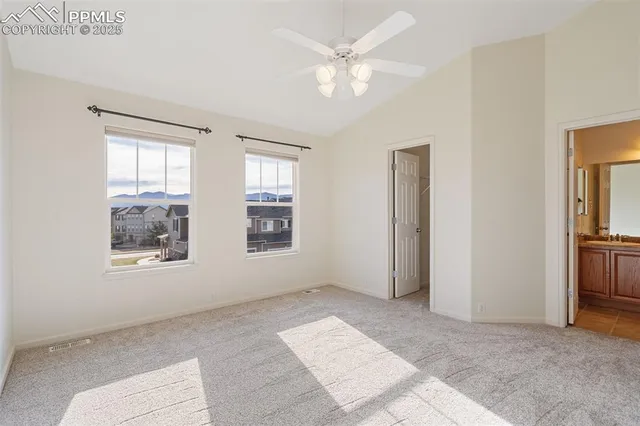 an empty room with windows and closet