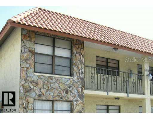 6615 Deeb Street, Unit 18 Port Richey, FL 34668 - Photo 1 of 1 a backyard of a house