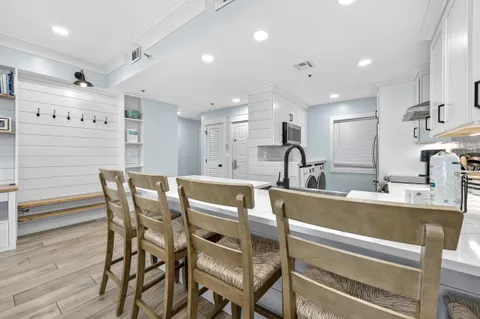 a utility room with sink washer and dryer