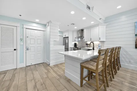 a kitchen with a refrigerator and a stove