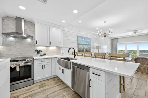 a spacious bedroom with a bed and a flat screen tv