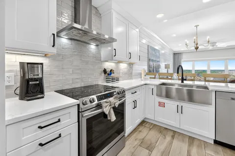a bedroom with a large bed and a flat screen tv