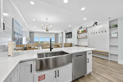 a large bedroom with a bed and large window