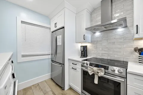 a bedroom with a large bed and a large window