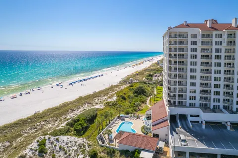an aerial view of a house with outdoor space swimming pool