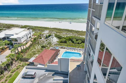 a view of a backyard with a garden and entertaining space