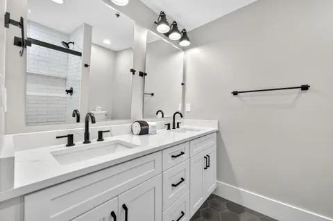 a kitchen with a sink stove and refrigerator