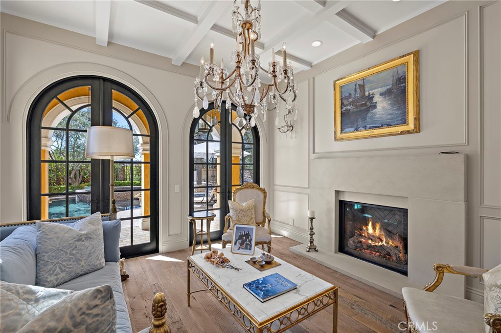 12 Thomas Road Ladera Ranch, CA 92694 - Photo 11 of 70 a living room with furniture a fireplace and a chandelier