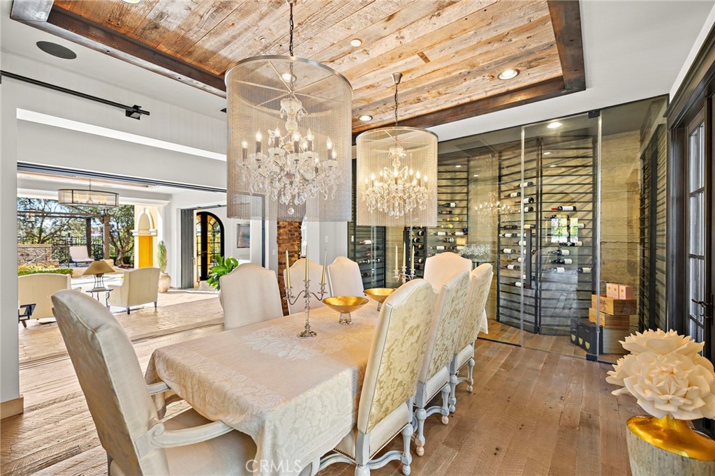 12 Thomas Road Ladera Ranch, CA 92694 - Photo 15 of 70 a view of a dining room with furniture wooden floor and chandelier