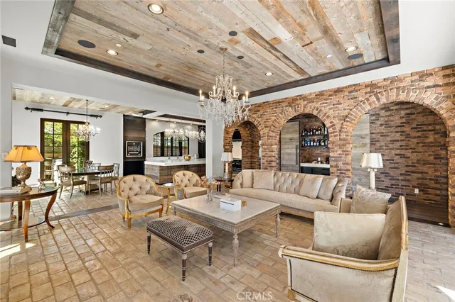 a dining hall with granite countertop a sink and a stove