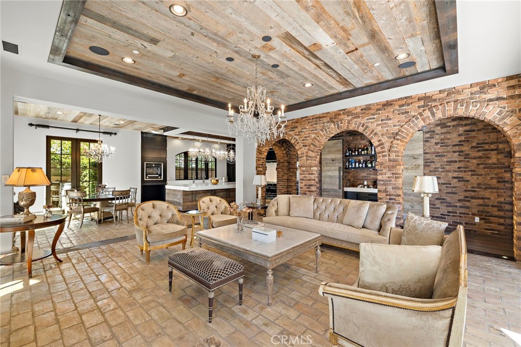 12 Thomas Road Ladera Ranch, CA 92694 - Photo 18 of 70 a living room with patio furniture and a chandelier