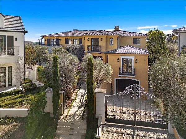 a view of swimming pool with outdoor seating and trees in the background