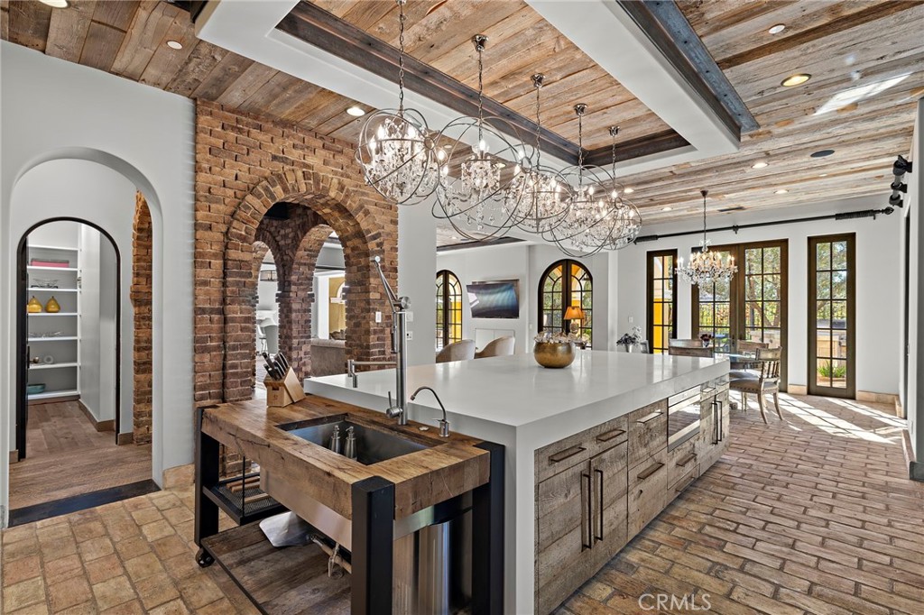 12 Thomas Road Ladera Ranch, CA 92694 - Photo 25 of 70 a dining hall with granite countertop a sink and a stove