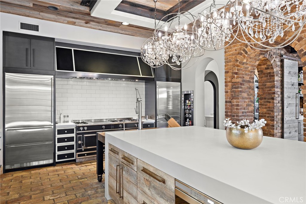 12 Thomas Road Ladera Ranch, CA 92694 - Photo 27 of 70 a kitchen with a stove and a microwave