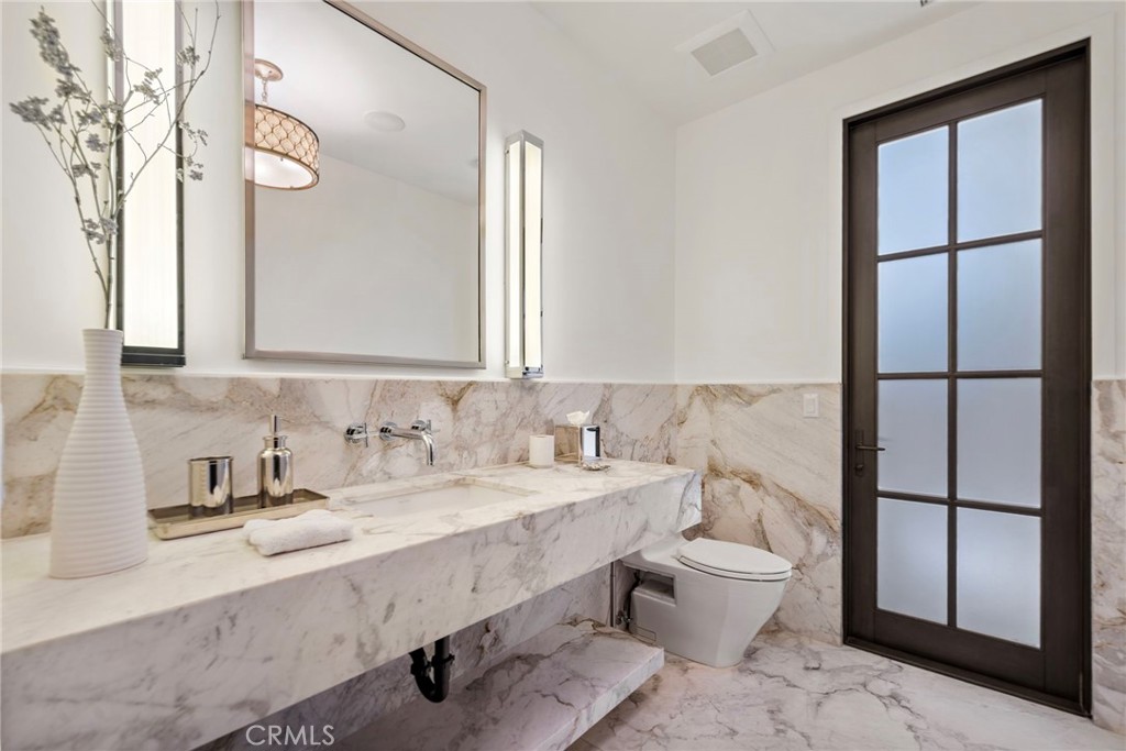 12 Thomas Road Ladera Ranch, CA 92694 - Photo 30 of 70 a bathroom with a sink and a mirror