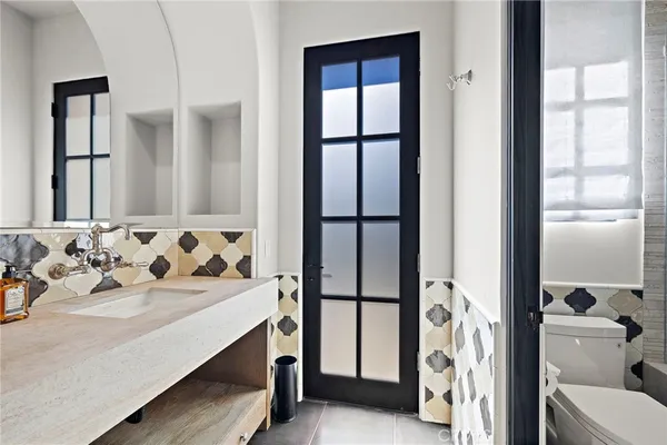 a bathroom with a sink double vanity and a mirror