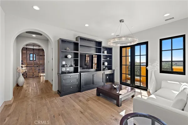a dining room with furniture and wooden floor