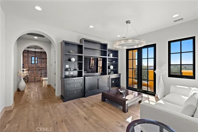 a dining room with furniture and wooden floor