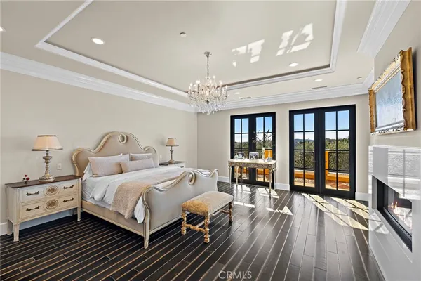 a view of a patio with table and chairs with wooden floor and fence