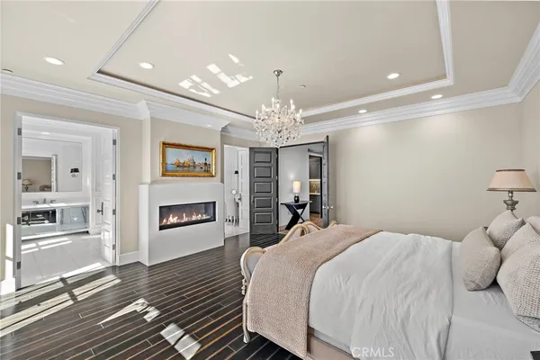 a kitchen with stainless steel appliances granite countertop cabinets a sink a stove a dining table and chairs